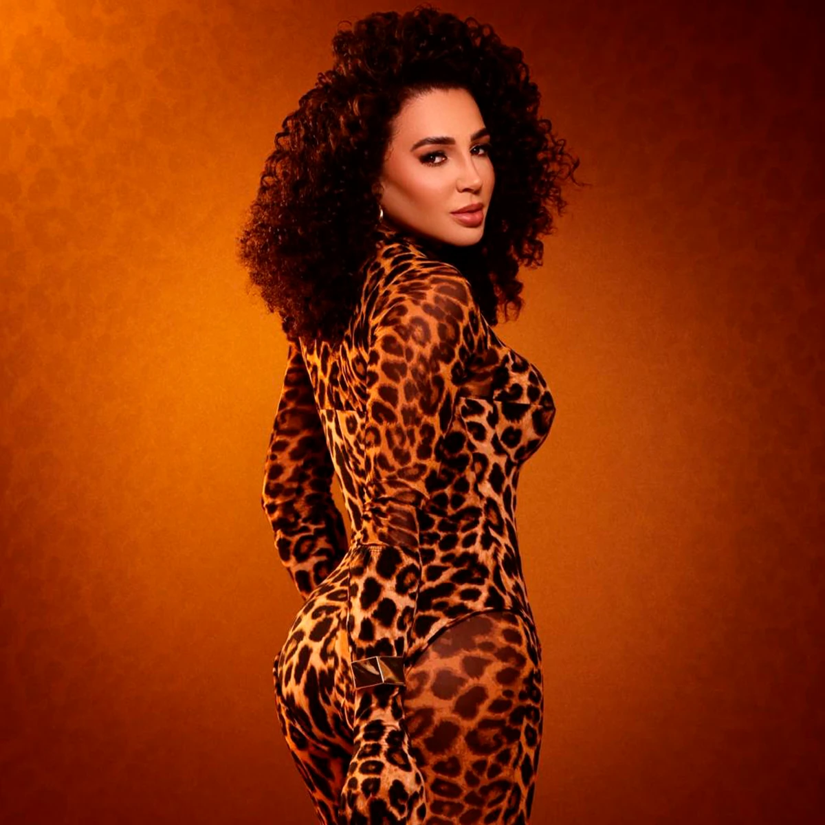 Editorial portrait of Larissa in a leopard-print outfit